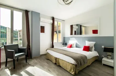 Un ou plusieurs lits dans un hébergement de l'établissement Florella République Apartment