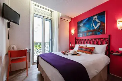 Un ou plusieurs lits dans un hébergement de l'établissement Hôtel Brimer Cannes