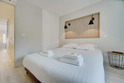 Un ou plusieurs lits dans un hébergement de l'établissement IMMOGROOM - AC - 5min from the beaches 8 min from Palais