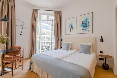 Un ou plusieurs lits dans un hébergement de l'établissement La Guitare 23 - Large modern studio with balcony in center of Cannes, just behind Grand Hotel