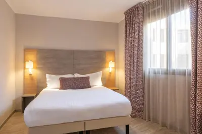Un ou plusieurs lits dans un hébergement de l'établissement Hôtel Bahia