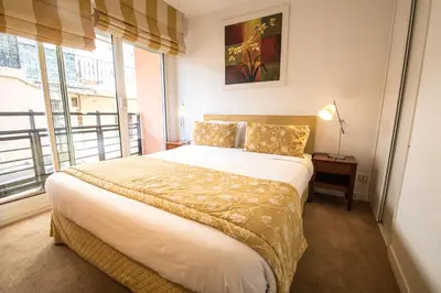Un ou plusieurs lits dans un hébergement de l'établissement Cannes Croisette Prestige Apart'hotel