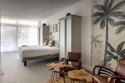 Un ou plusieurs lits dans un hébergement de l'établissement Hôtel La Villa Juan Beach