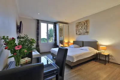 Un ou plusieurs lits dans un hébergement de l'établissement Emeraude Résidence Hotelière
