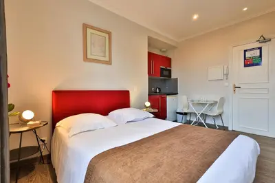 Un ou plusieurs lits dans un hébergement de l'établissement Emeraude Résidence Hotelière