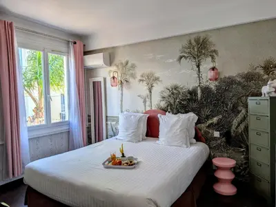 Un ou plusieurs lits dans un hébergement de l'établissement Hôtel Mademoiselle