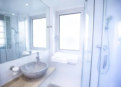 Salle de bains dans l'établissement Tiercé Hotel
