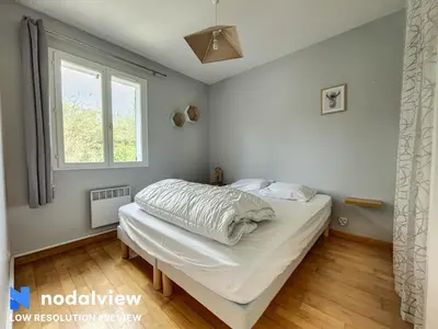 Un ou plusieurs lits dans un hébergement de l'établissement Villa Azurella