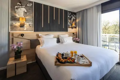 Un ou plusieurs lits dans un hébergement de l'établissement Mouratoglou Hotel & Resort