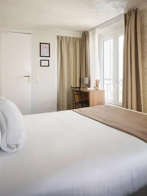 Un ou plusieurs lits dans un hébergement de l'établissement Hotel des Congrès et Festivals