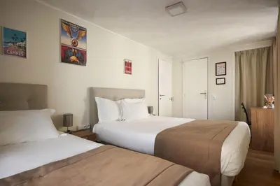 Un ou plusieurs lits dans un hébergement de l'établissement Hotel des Congrès et Festivals