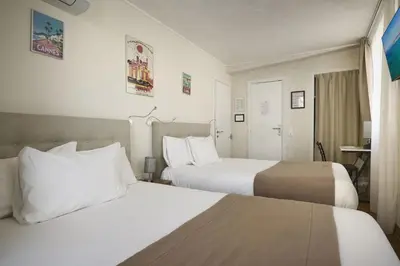 Un ou plusieurs lits dans un hébergement de l'établissement Hotel des Congrès et Festivals