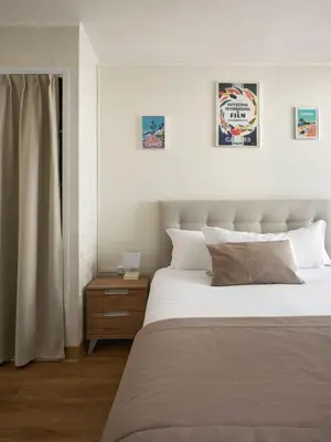 Un ou plusieurs lits dans un hébergement de l'établissement Hotel des Congrès et Festivals