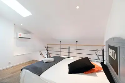 Un ou plusieurs lits dans un hébergement de l'établissement Atelier Duplex