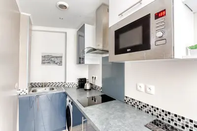 Cuisine ou kitchenette dans l'établissement Cosy apartment + secured PARKING