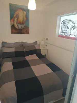 Un ou plusieurs lits dans un hébergement de l'établissement Le Palais du Tropique appartement vue mer 5é étage avec ascenseur