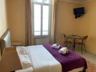 Un ou plusieurs lits dans un hébergement de l'établissement Village Croisette