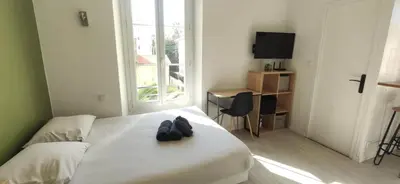 Un ou plusieurs lits dans un hébergement de l'établissement APPARTEMENT CANNES MONTFLEURY