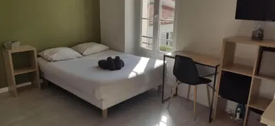 Un ou plusieurs lits dans un hébergement de l'établissement APPARTEMENT CANNES MONTFLEURY