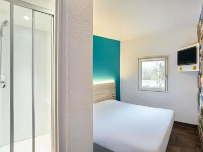 Un ou plusieurs lits dans un hébergement de l'établissement hotelF1 Antibes Sophia Antipolis