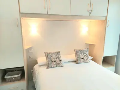Un ou plusieurs lits dans un hébergement de l'établissement Plage la Salis 3 chambres, Jardin - 3 bedrooms
