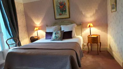 Un ou plusieurs lits dans un hébergement de l'établissement Hotel Relais Du Postillon