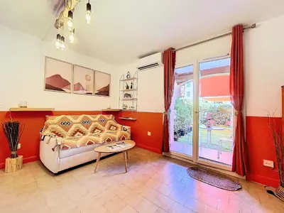 Un ou plusieurs lits dans un hébergement de l'établissement Cosy, Wi-Fi, jardin & parking, Jasmins Studio entre Cannes et Antibes