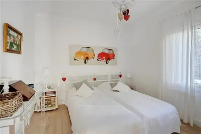 Un ou plusieurs lits dans un hébergement de l'établissement Le Cabanon Cap d Antibes 80 m de la plage