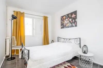 Un ou plusieurs lits dans un hébergement de l'établissement Appartement Corail - Welkeys