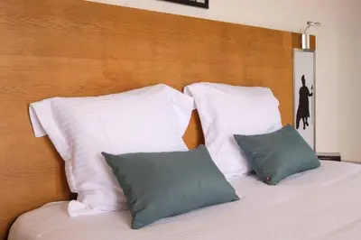 Un ou plusieurs lits dans un hébergement de l'établissement Comfort Aparthotel Antibes Le Maestria
