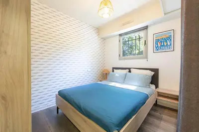 Un ou plusieurs lits dans un hébergement de l'établissement Salvy 2 bedrooms near the beach 300 meters