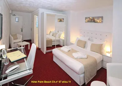 Un ou plusieurs lits dans un hébergement de l'établissement HOTEL PALM BEACH