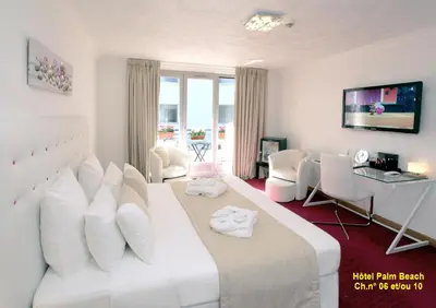 Un ou plusieurs lits dans un hébergement de l'établissement HOTEL PALM BEACH