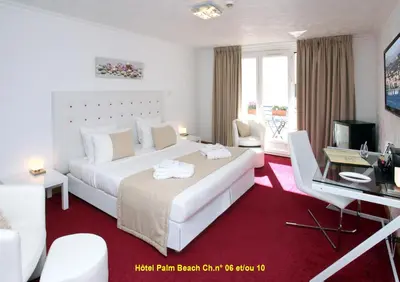 Un ou plusieurs lits dans un hébergement de l'établissement HOTEL PALM BEACH