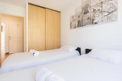Un ou plusieurs lits dans un hébergement de l'établissement Quartier Vauban 2 bedroom apartment