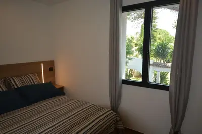Un ou plusieurs lits dans un hébergement de l'établissement Les villas du Golf Mougins