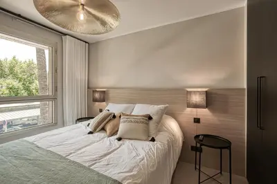 Un ou plusieurs lits dans un hébergement de l'établissement Luxury flat with balcony - city center Cannes