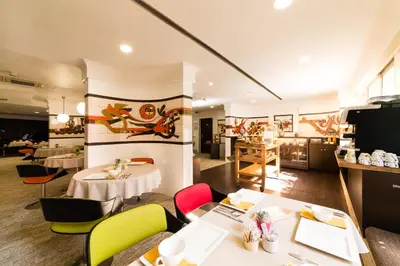 Coin salon dans l'établissement Hôtel Hélios