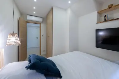 Un ou plusieurs lits dans un hébergement de l'établissement Beautiful apartment 7P City Center Beach 250m