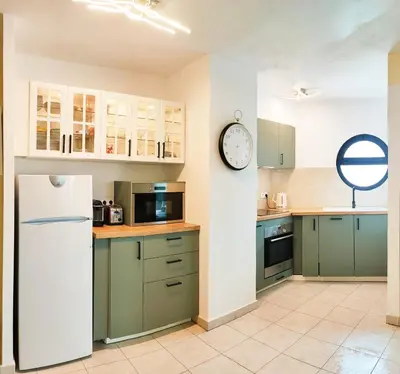 Cuisine ou kitchenette dans l'établissement Appartement 6 personnes face à la mer