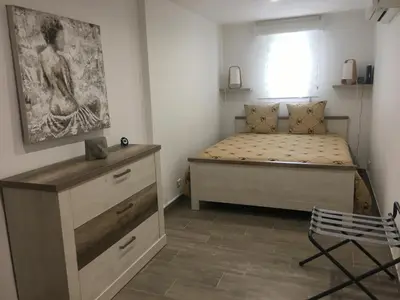 Un ou plusieurs lits dans un hébergement de l'établissement Loft ravissant avec piscine