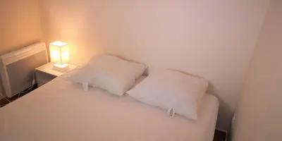 Un ou plusieurs lits dans un hébergement de l'établissement Résidence Cap Azur Appartement 209