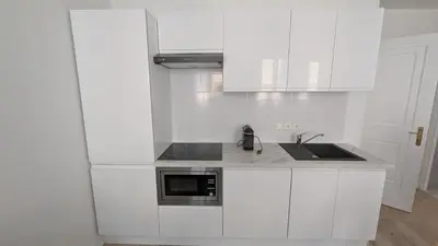 Cuisine ou kitchenette dans l'établissement La Fontaine