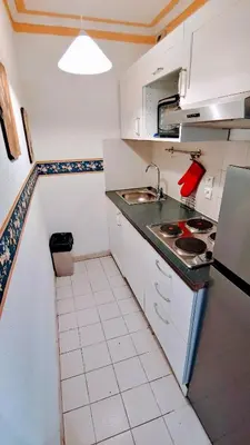 Cuisine ou kitchenette dans l'établissement GLORIADALI’