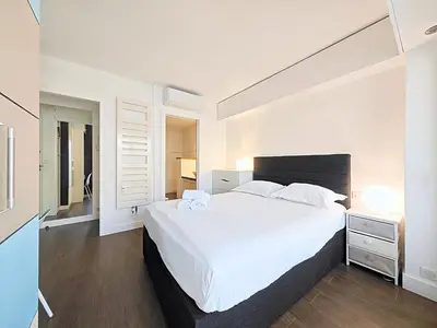 Un ou plusieurs lits dans un hébergement de l'établissement Viva Riviera Studio General Ferrié