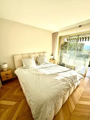 Un ou plusieurs lits dans un hébergement de l'établissement Garden sea view - Victoria - Le Cannet