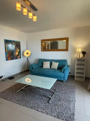 Coin salon dans l'établissement Fully equipped beachfront studio in the heart of the city center bd Leclerc