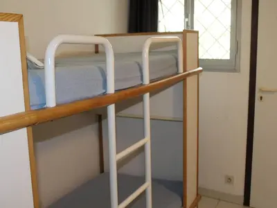 Un ou plusieurs lits superposés dans un hébergement de l'établissement Appartement 3P en RDJ avec Jardin, accès plage direct, 4 à 6 couchages - Villeneuve-Loubet Plage - FR-1-252A-73