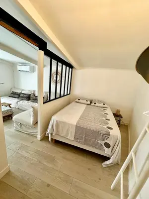 Un ou plusieurs lits dans un hébergement de l'établissement Charmante maison