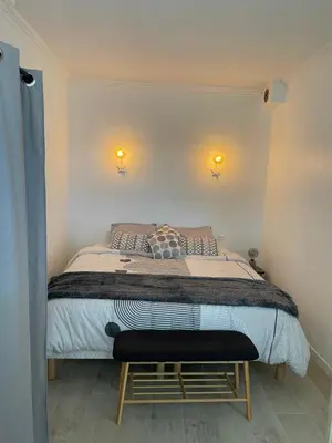 Un ou plusieurs lits dans un hébergement de l'établissement Charmante maison
